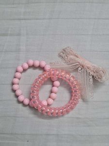 Two coquette lana coded bracelets