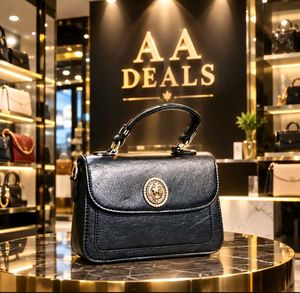 Chic Black Handbag with Gold Embellishment