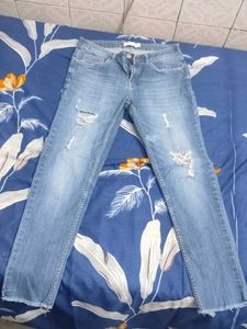 Distressed Light Wash Denim Jeans