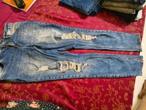 Distressed Blue Denim Jeans