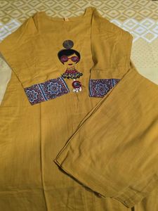 Stylish Mustard Kurta Set with Embellished Necklin