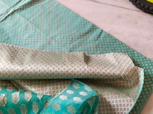 Beautiful Teal dress material with woven silk work