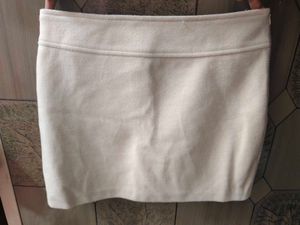 cream colour short skirt.