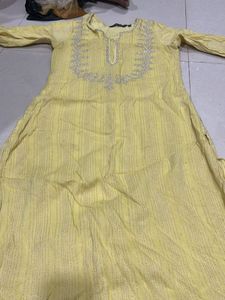 Elegant Yellow Kurta with Intricate Embellishments