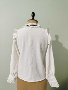 Ruffled White Blouse with Black Bow