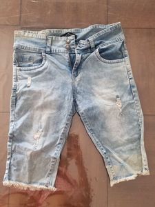 Distressed Light Wash Denim Capris