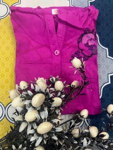 pink sleeveless shirt with cap