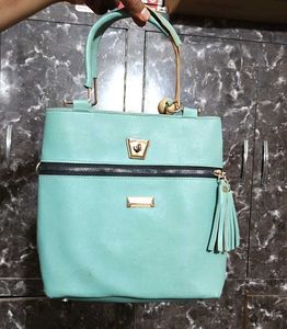 Chic Teal Handbag with Gold Accents
