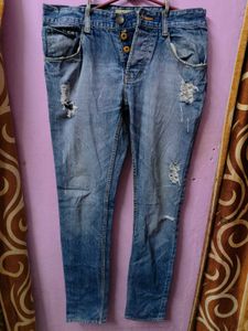 Distressed Blue Denim Jeans