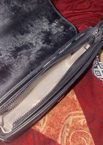 Stylish Black Crossbody Bag with Patterned Strap