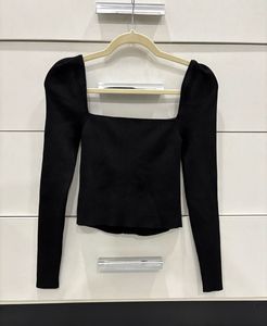 Chic Black Top with gold buttons