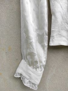 Elegant White Ruffled Blouse