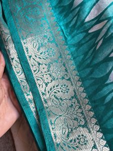 Elegant Teal Saree with Intricate Border