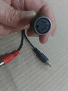 A 5-pin DIN male connector splitting into two