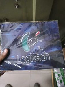 Logitech Mouse Pad , green pen and marker