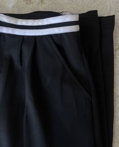 Black trousers with white stripe detail
