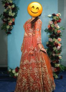 Stunning Orange Embellished Lehenga Choli