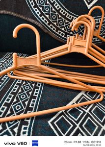 Set of Orange Plastic Hangers