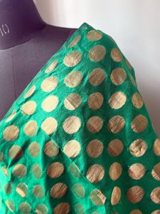 Green fabric with Gold Polka Dots