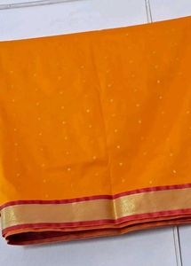 Vibrant Orange Saree with Gold Border