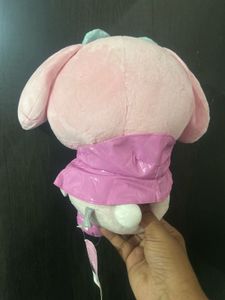Sanrio My Melody plush toy wearing a glossy pink