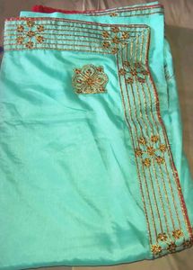 Stunning Teal Saree with Gold Embellishments