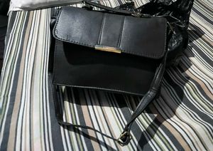 Chic Black Handbag with Charm