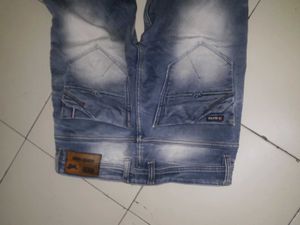 Distressed Blue Denim Jeans
