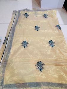 Elegant Embroidered Cream Saree