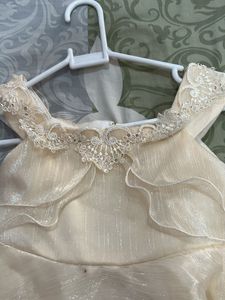 Elegant Cream Ruffled frock
