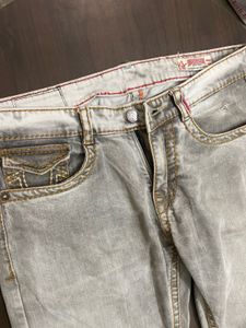 TRUE RELIGION WITH SMALL INK DOT AT BACK