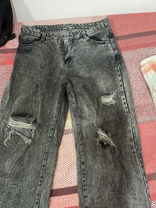 Acid washed distressed black oversized jeans