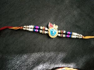 Elegant Rakhi with Red Pearls