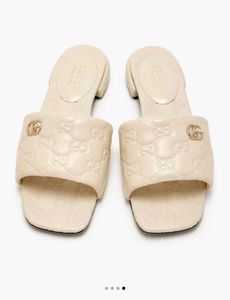Gucci Embossed Slides - Cream