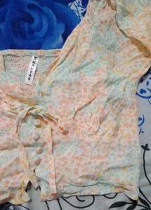 long-sleeve cropped blouse with a tie-front