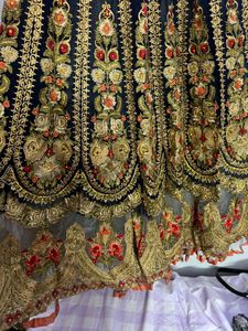 long heavy tail cut dress with intricate embroider