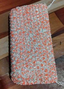 beautiful stylish orange and white colour sling ba