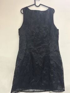Shiny reflecting black dress