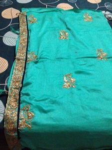 Elegant Teal Saree with Gold Embroidery
