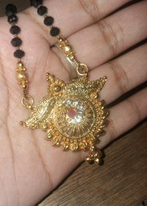 Mangalsutra. Exquisite Gold Necklace with Red Ston