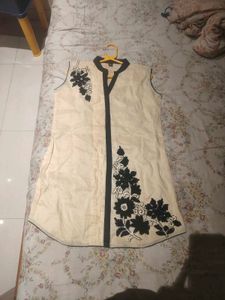 A contemporary short white kurta- no brand, worn o