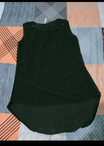 Chic Black Sleeveless Top with Polka Dot Hem