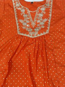 Vibrant Orange Kurti with White Polka Dots
