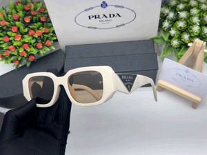 Prada Sunglasses - Chic Pink Tinted Lenses