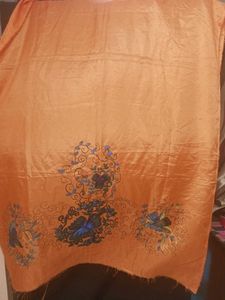 Orange colour dress material with Floral Border