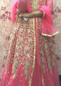 A Beautiful Pinkish Gown With Golden Work