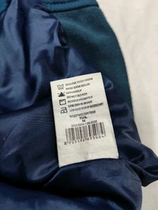 Sleeveless Teal Jacket