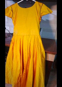 long yellow satin gown with black embroidery