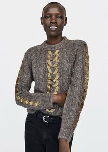 Zara sweater with gold-tone embellishments.