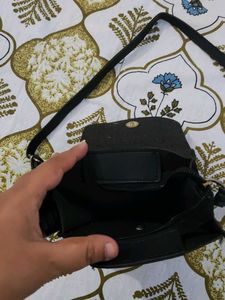 Stylish Black Crossbody Bag with Ring Detail